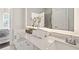 Bathroom vanity with quartz countertops, double sinks, and LED mirror at 456 Parkway Ne Dr # 10, Atlanta, GA 30308