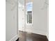 Bright closet with dark hardwood floors, modern window and metal shelving at 456 Parkway Ne Dr # 10, Atlanta, GA 30308