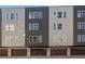 Modern townhome complex featuring private garages, neutral colors, and clean lines at 456 Parkway Ne Dr # 10, Atlanta, GA 30308