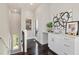 Hallway wet bar features modern cabinets, marble countertop, and art at 456 Parkway Ne Dr # 10, Atlanta, GA 30308