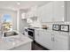 Bright kitchen features white cabinets, stainless steel appliances, and a gorgeous marble countertop at 456 Parkway Ne Dr # 10, Atlanta, GA 30308