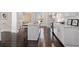 Bright and airy kitchen featuring white cabinets, a center island, and modern appliances at 456 Parkway Ne Dr # 10, Atlanta, GA 30308