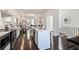 Spacious kitchen with white cabinets, island, stainless steel appliances, and hardwood floors at 456 Parkway Ne Dr # 10, Atlanta, GA 30308