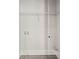 Neutral laundry room with gray tile flooring and storage shelving at 456 Parkway Ne Dr # 10, Atlanta, GA 30308