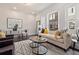 Living room with stylish decor, a comfortable sofa, and bright windows at 456 Parkway Ne Dr # 10, Atlanta, GA 30308