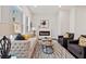 Inviting living room featuring a comfortable sofa, stylish chairs, and a modern fireplace at 456 Parkway Ne Dr # 10, Atlanta, GA 30308