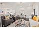 Open-concept living room with stylish furnishings, modern decor, and a bright kitchen at 456 Parkway Ne Dr # 10, Atlanta, GA 30308