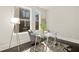 Bright office space featuring a glass desk, modern lamp, and graphic rug at 456 Parkway Ne Dr # 10, Atlanta, GA 30308