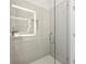 Glass shower features gray subway tiles, hexagonal flooring, and modern fixtures at 456 Parkway Ne Dr # 10, Atlanta, GA 30308