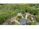 Overhead view of a beautiful home nestled among lush trees in a desirable, quiet neighborhood at 1360 Woodvine Way, Alpharetta, GA 30005
