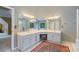 Bathroom with double vanity and mirrors, tile flooring and lots of natural light at 1360 Woodvine Way, Alpharetta, GA 30005