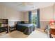 Bedroom features large window with blinds, a black bookshelf and a full-sized bed at 1360 Woodvine Way, Alpharetta, GA 30005
