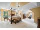 Expansive main bedroom with trey ceilings, large windows, ceiling fan, and sitting area at 1360 Woodvine Way, Alpharetta, GA 30005