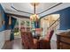 Dining room with chandelier, trey ceiling and decorative window with an inviting garden view at 1360 Woodvine Way, Alpharetta, GA 30005