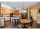 Charming kitchen with hardwood floors, granite counters, and a cozy breakfast nook at 1360 Woodvine Way, Alpharetta, GA 30005