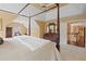 Expansive main bedroom with a canopy bed, sitting area, and ensuite access at 1360 Woodvine Way, Alpharetta, GA 30005