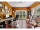 Inviting home office space with large windows, a desk, and hardwood flooring at 1360 Woodvine Way, Alpharetta, GA 30005