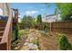 Landscaped backyard with a stone path, plants, and a tranquil retreat, great for relaxing outdoors at 200 Valley Xing, Canton, GA 30114