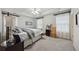 Spacious bedroom with a tray ceiling, carpeted floors, and bright window lighting at 200 Valley Xing, Canton, GA 30114