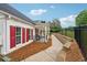 Charming clubhouse exterior with red shutters, a welcoming porch, and accessible walkway at 200 Valley Xing, Canton, GA 30114