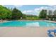 Large outdoor swimming pool for residents' enjoyment, surrounded by lounge chairs and greenery at 200 Valley Xing, Canton, GA 30114