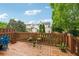 Wooden deck with plants and room for outdoor seating, offering a relaxing space to enjoy the surrounding views at 200 Valley Xing, Canton, GA 30114