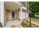 Inviting covered front porch with decorative wreath and adjacent two-car garage at 200 Valley Xing, Canton, GA 30114