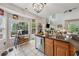 Sunlit kitchen with stainless steel appliances, tile floor, and granite countertops at 200 Valley Xing, Canton, GA 30114