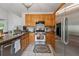 Functional kitchen with stainless steel appliances, tile flooring, and granite countertops at 200 Valley Xing, Canton, GA 30114
