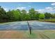 Well-maintained tennis court surrounded by lush greenery for active recreation and community engagement at 200 Valley Xing, Canton, GA 30114