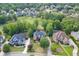 Expansive aerial view of a suburban home nestled within a meticulously planned neighborhood with manicured lawns at 2118 Town Manor Ct, Dacula, GA 30019