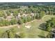 Beautiful aerial view of golf course home, landscaped with mature trees at 2118 Town Manor Ct, Dacula, GA 30019