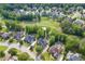 A high-angle view of suburban houses positioned near a lush golf course, highlighting the scenic surroundings at 2118 Town Manor Ct, Dacula, GA 30019
