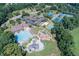 Aerial view showcasing the community pool, playground, clubhouse and aquatic play area at 2118 Town Manor Ct, Dacula, GA 30019