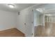 View of finished basement featuring hardwood flooring, neutral paint, and a standard white door at 2118 Town Manor Ct, Dacula, GA 30019