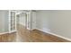 Finished basement with hardwood flooring and french doors leading to a separate room at 2118 Town Manor Ct, Dacula, GA 30019