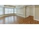 Finished basement with hardwood flooring, bay windows, and white trim at 2118 Town Manor Ct, Dacula, GA 30019