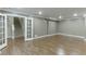 Basement with hardwood floors leads to a staircase, offering a versatile space with recessed lights and crown molding at 2118 Town Manor Ct, Dacula, GA 30019