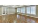 Finished basement featuring beautiful hardwood flooring and a set of glass french doors at 2118 Town Manor Ct, Dacula, GA 30019