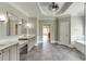 Open bathroom showcasing double vanities, sleek tiling, and modern fixtures, creating a luxurious and functional space at 2118 Town Manor Ct, Dacula, GA 30019