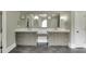 Bathroom with double vanities, granite countertops, and modern fixtures, providing ample space and storage at 2118 Town Manor Ct, Dacula, GA 30019