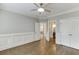 Inviting bedroom offers hardwood floors, classic molding, and ample closet space at 2118 Town Manor Ct, Dacula, GA 30019
