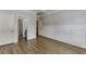 Bedroom featuring hardwood floors, wainscotting, and ensuite bathroom at 2118 Town Manor Ct, Dacula, GA 30019