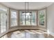 Cozy breakfast nook features large windows overlooking the backyard and beautiful hardwood floors at 2118 Town Manor Ct, Dacula, GA 30019