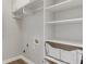 Walk-in closet features white shelving and ample storage space for all your wardrobe needs at 2118 Town Manor Ct, Dacula, GA 30019