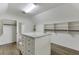 Spacious walk-in closet featuring custom shelving, storage island, and ample hanging space at 2118 Town Manor Ct, Dacula, GA 30019