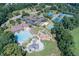Aerial view featuring community pool, playground, clubhouse, and recreational facilities at 2118 Town Manor Ct, Dacula, GA 30019