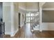 Elegant foyer boasting hardwood floors, a grand staircase, and soaring ceilings with decorative molding at 2118 Town Manor Ct, Dacula, GA 30019