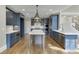 Stylish kitchen featuring an island, modern appliances, and sleek cabinetry at 2118 Town Manor Ct, Dacula, GA 30019