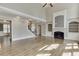 Spacious living room with hardwood floors, fireplace, and staircase at 2118 Town Manor Ct, Dacula, GA 30019